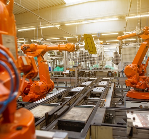 a factory filled with lots of orange machines