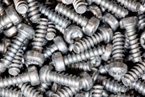 a pile of metal screws that are stacked on top of each other