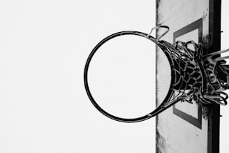 a black and white photo of a basketball hoop