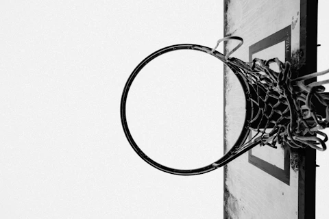 a black and white photo of a basketball hoop