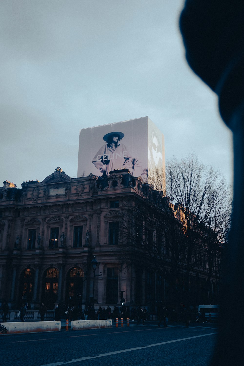 a large building with a giant advertisement on the side of it