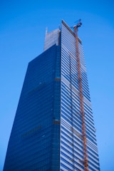a tall building with a crane on top of it