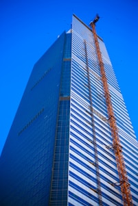 a tall building with a crane on top of it