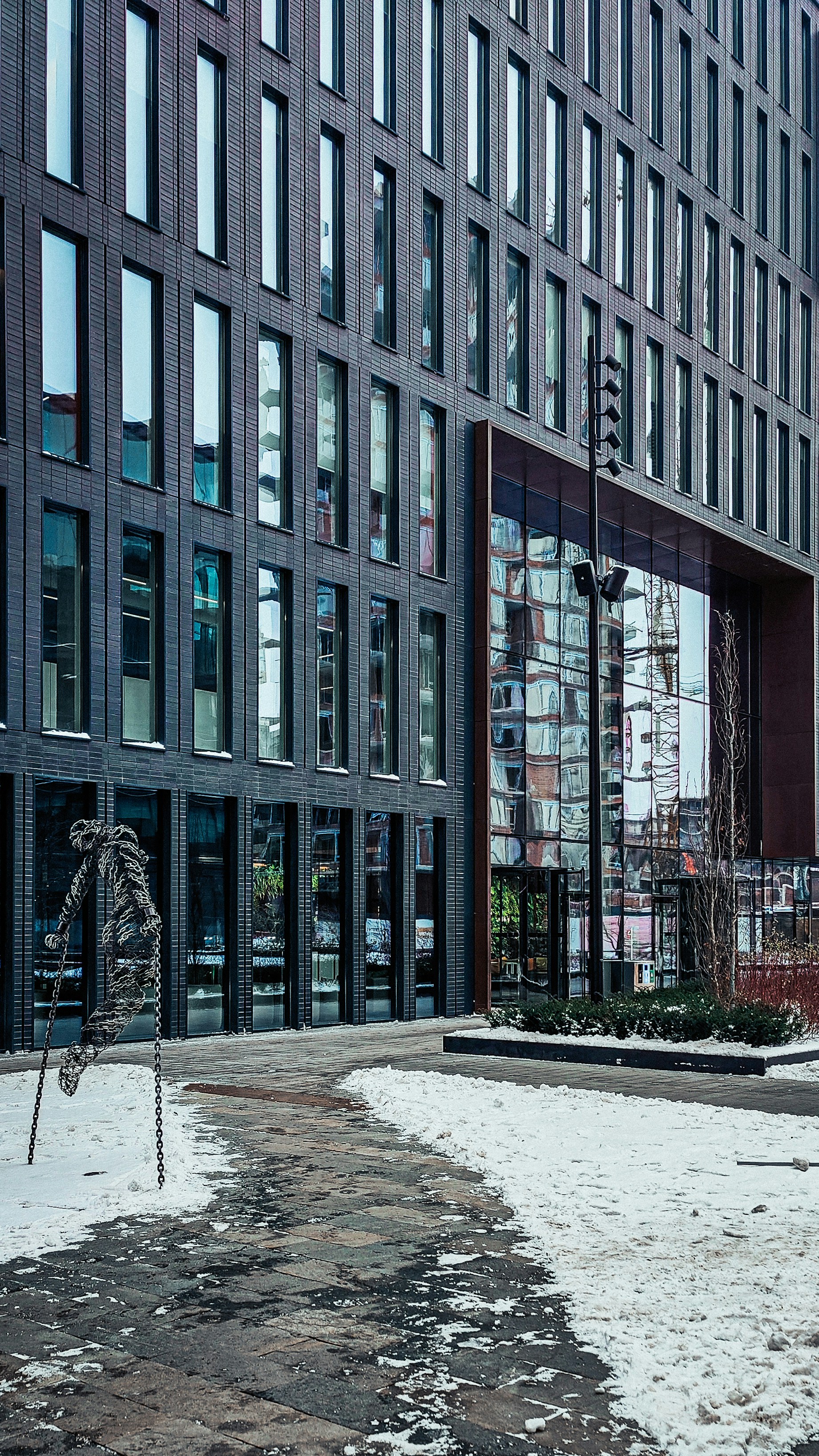 a building with a lot of windows and a street light