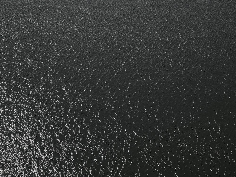 a black and white photo of a boat in the water