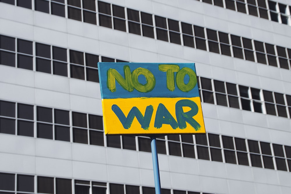 a no to war sign in front of a building