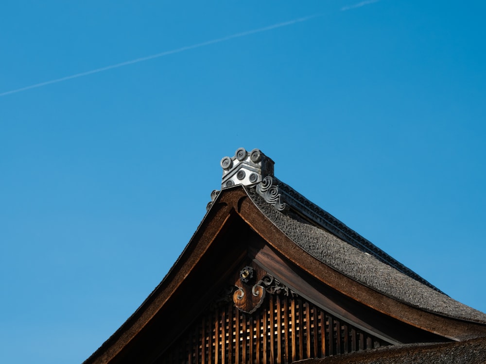 the roof of a building with a blue sky in the background