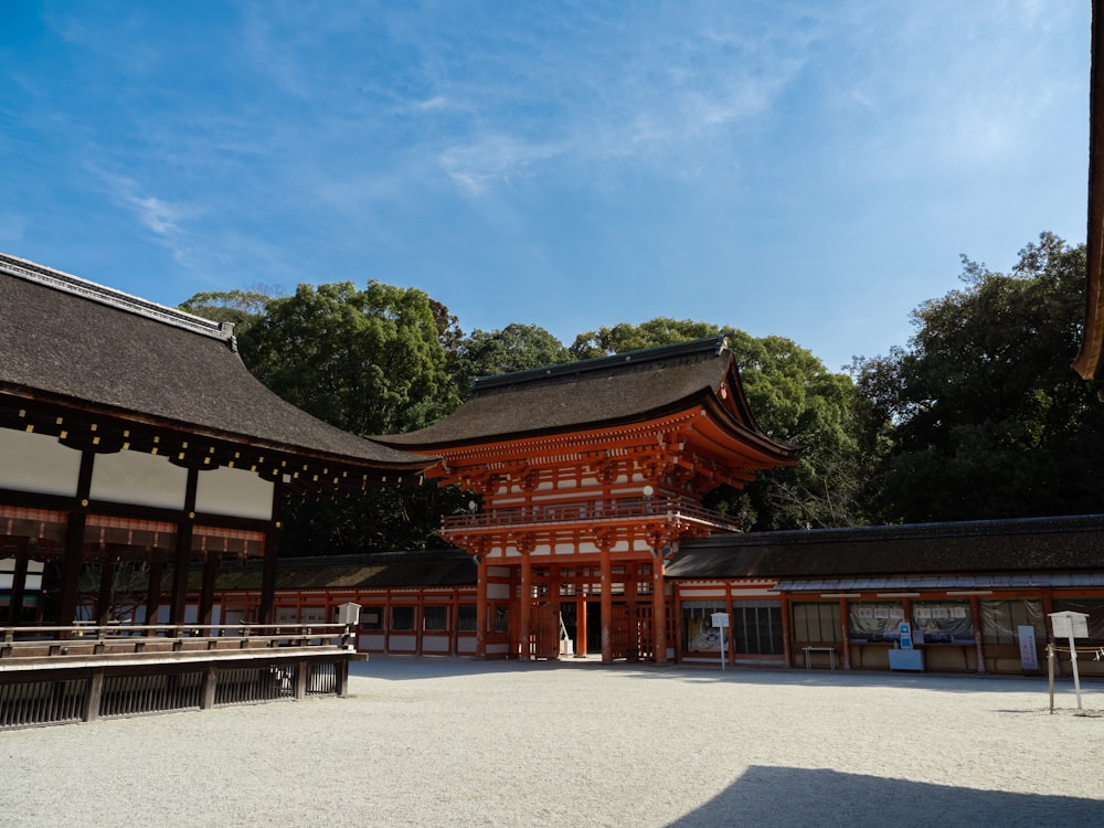 a large wooden building sitting next to a forest