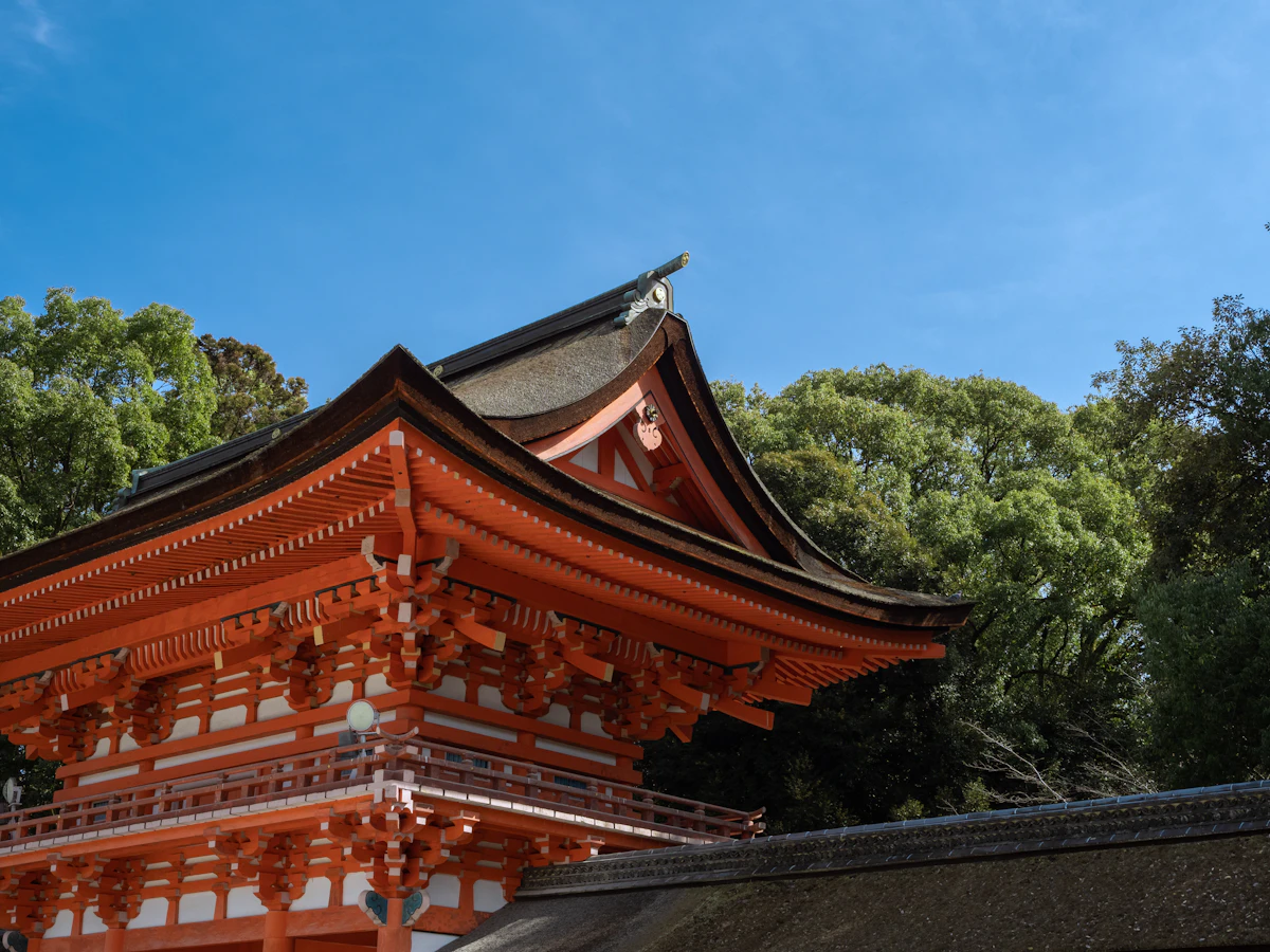 The red-lacquered main shrine building of Shimogamo Jinja surrounded by forest in Kyoto's Sakyo Ward