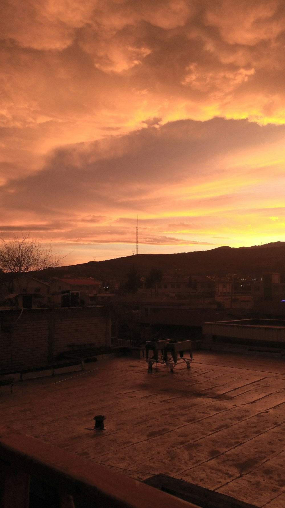 a view of a sunset from a rooftop
