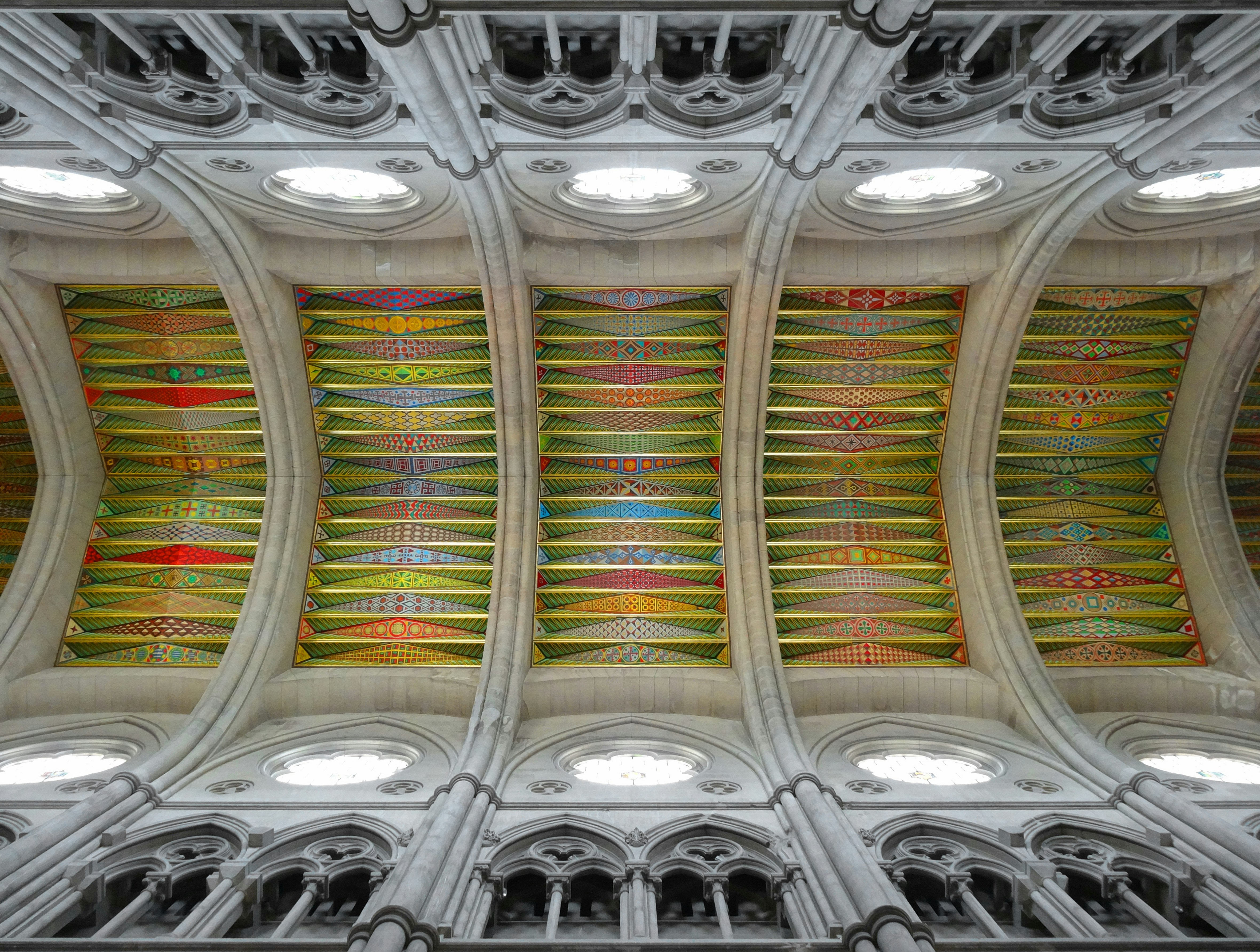 the ceiling of a cathedral with a colorful design