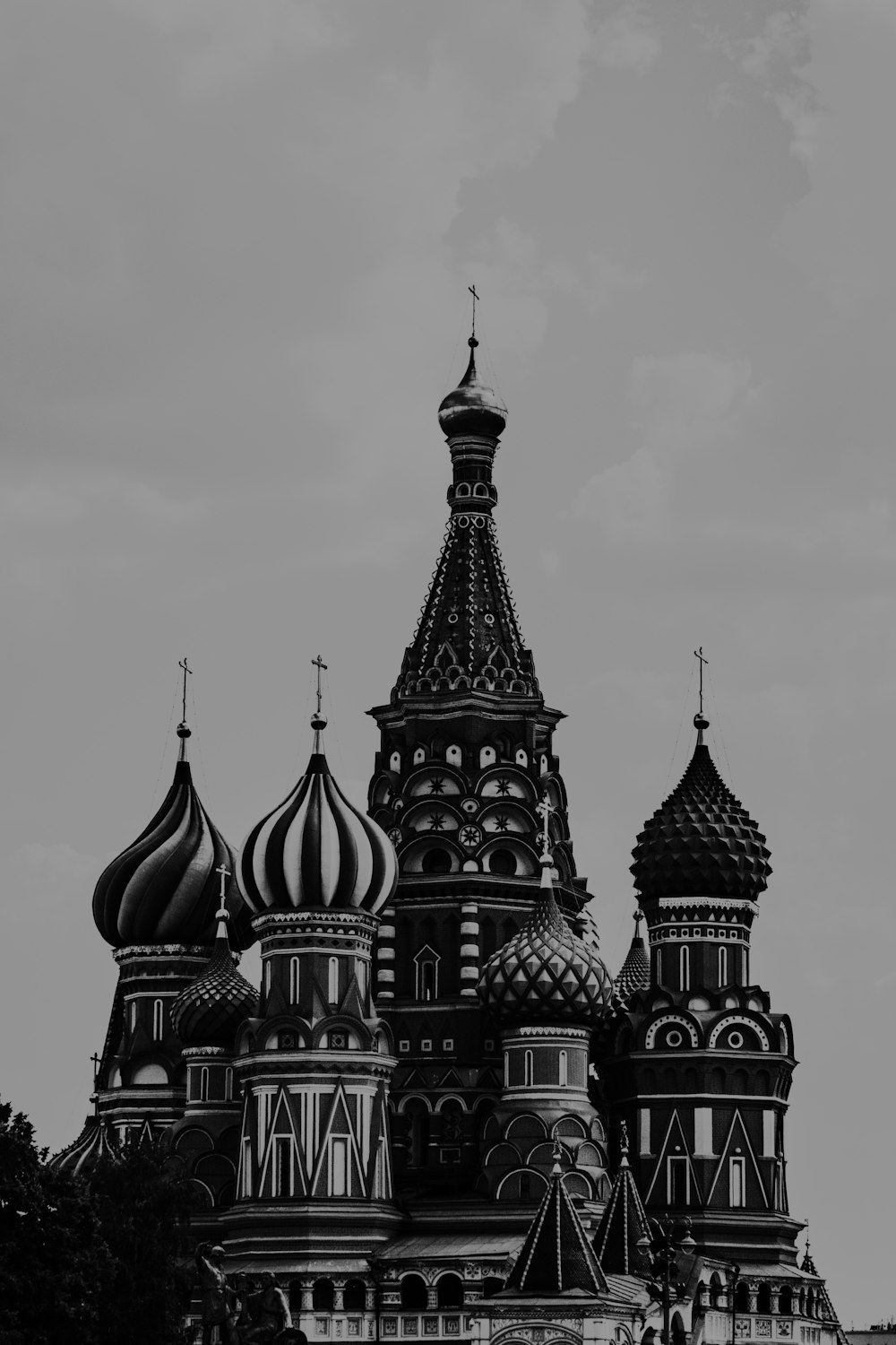 a black and white photo of a building with domes