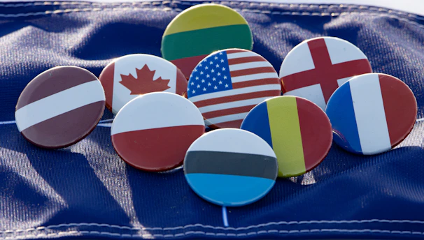 A vibrant collage of flags from member countries surrounding a globe symbolizing global partnership in short term rentals.