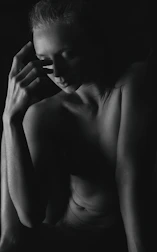 A calm moment captured during a somatic photography session, showing a relaxed expressive pose.