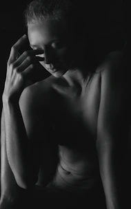 A calm moment captured during a somatic photography session, showing a relaxed expressive pose.