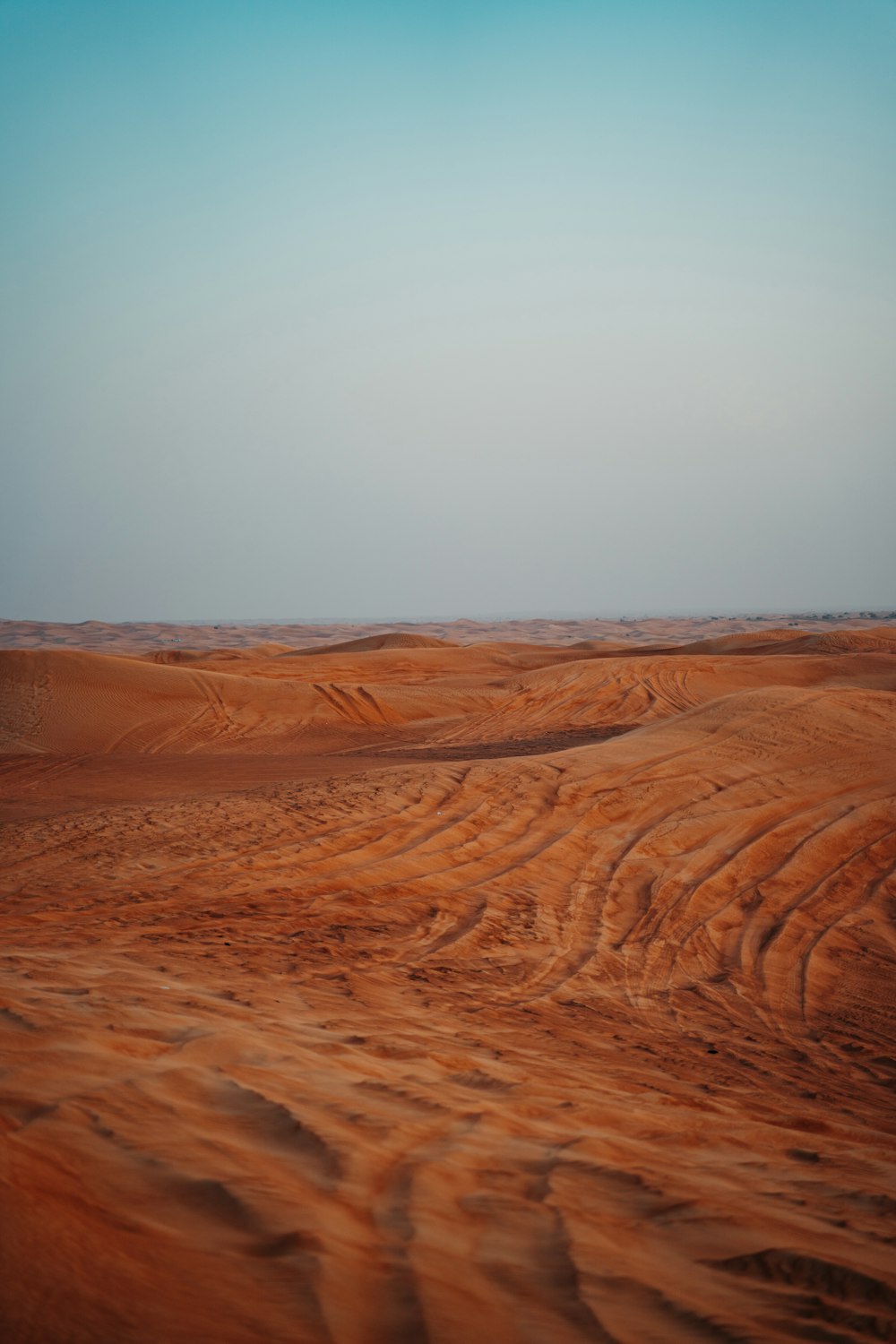 a vast expanse of sand in the middle of the desert