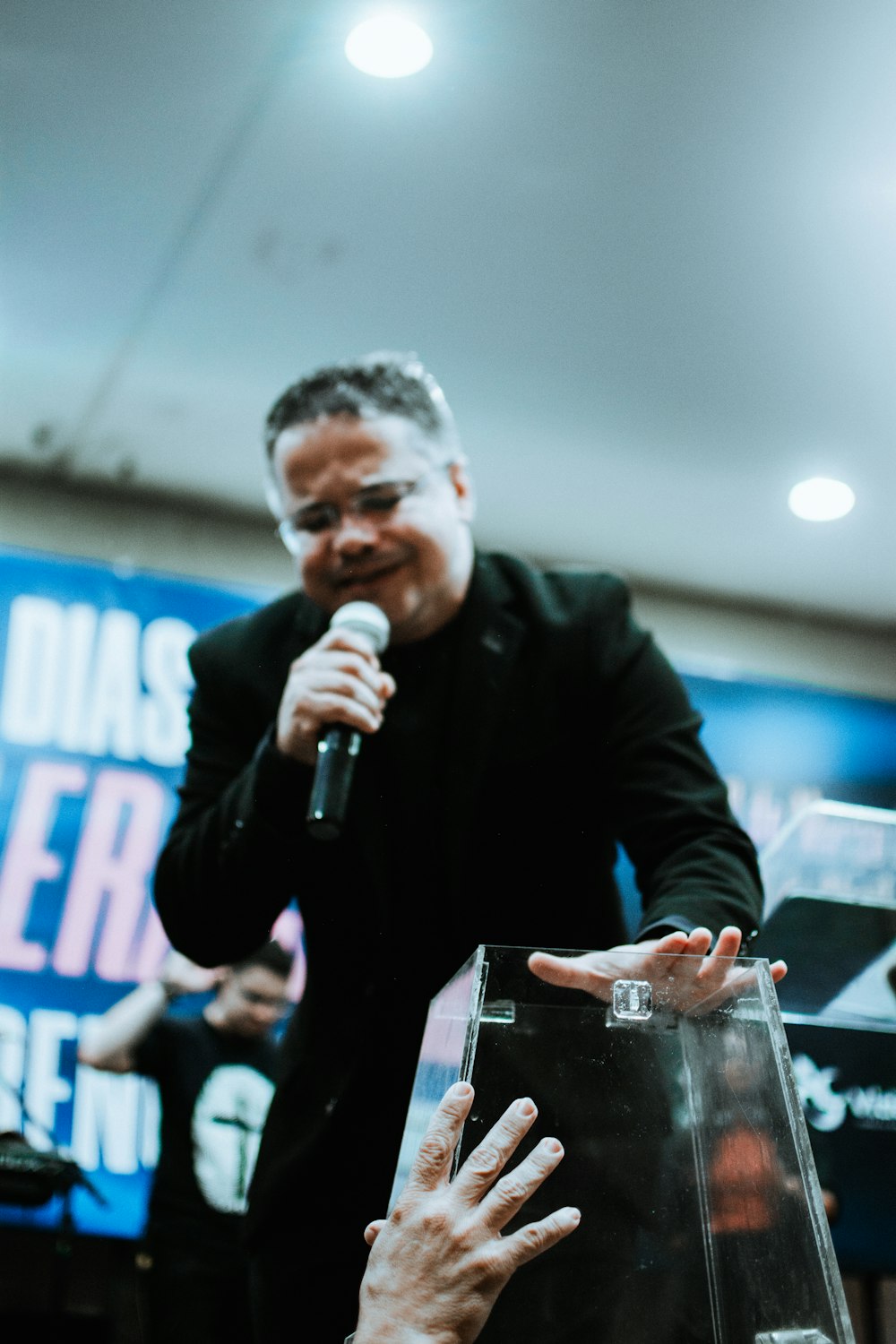 a man standing in front of a microphone