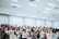 A group of diverse individuals participating in a voice workshop, engaging in expressive activities and enjoying the learning experience.