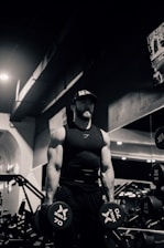 a man in a gym holding a barbell