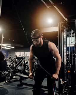 a man working out with a rope in a gym