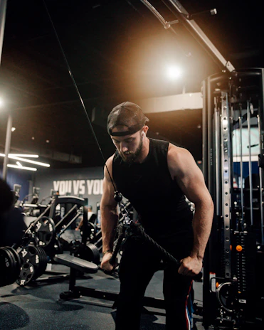 a man working out with a rope in a gym