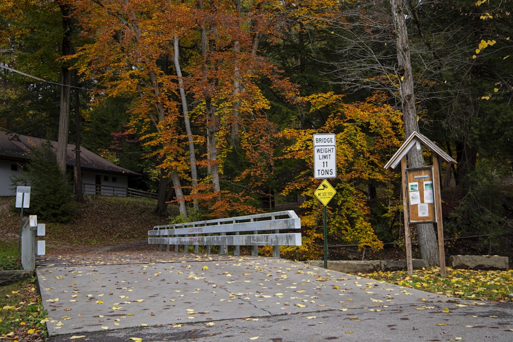 a road with a bridge and a sign on it