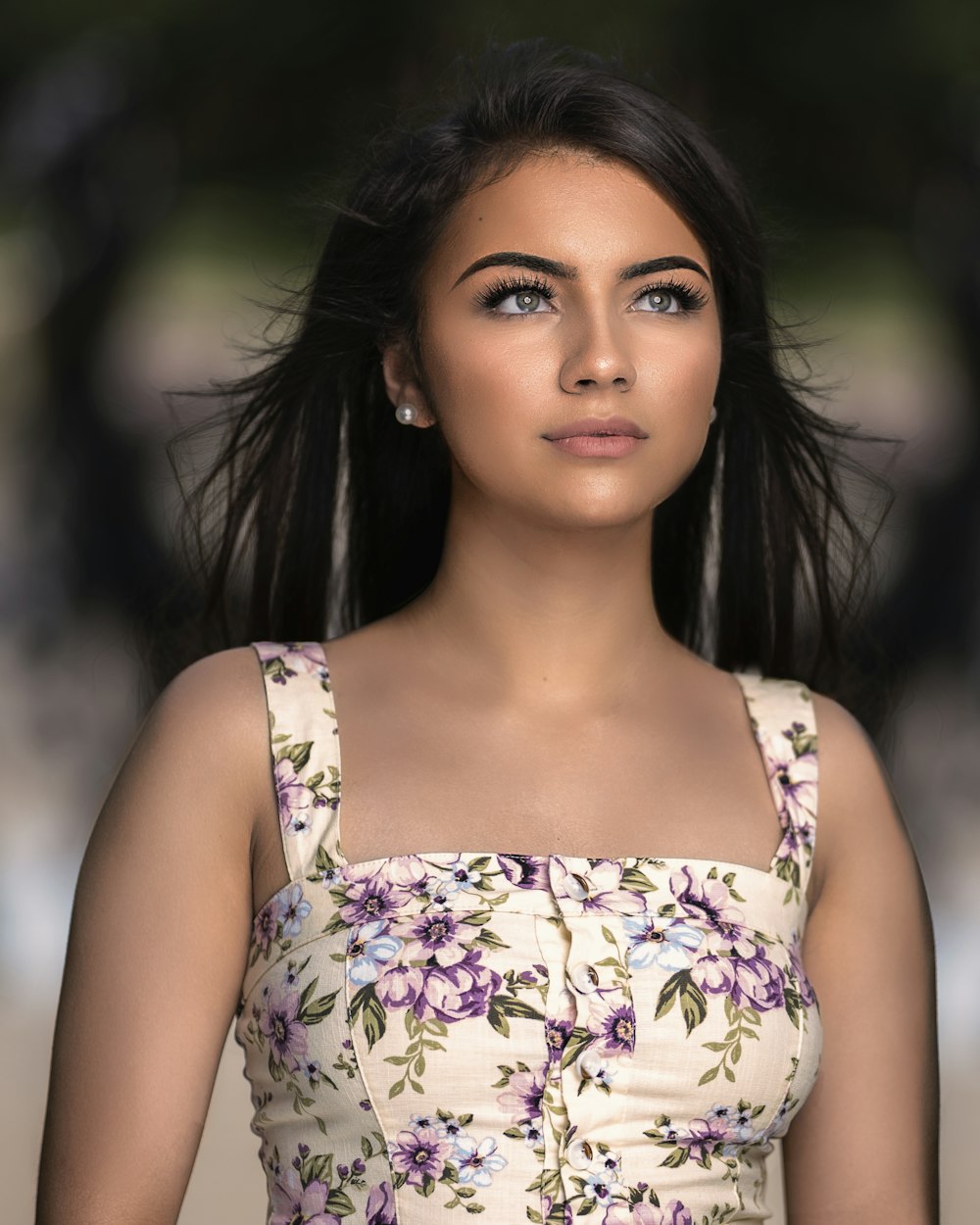 a woman with long hair wearing a dress