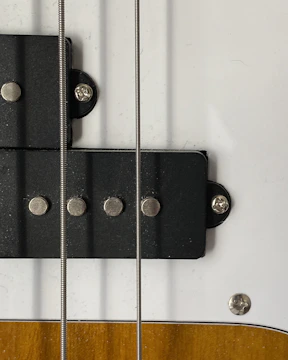 Close-up of reclaimed wood pieces ready for guitar repair.