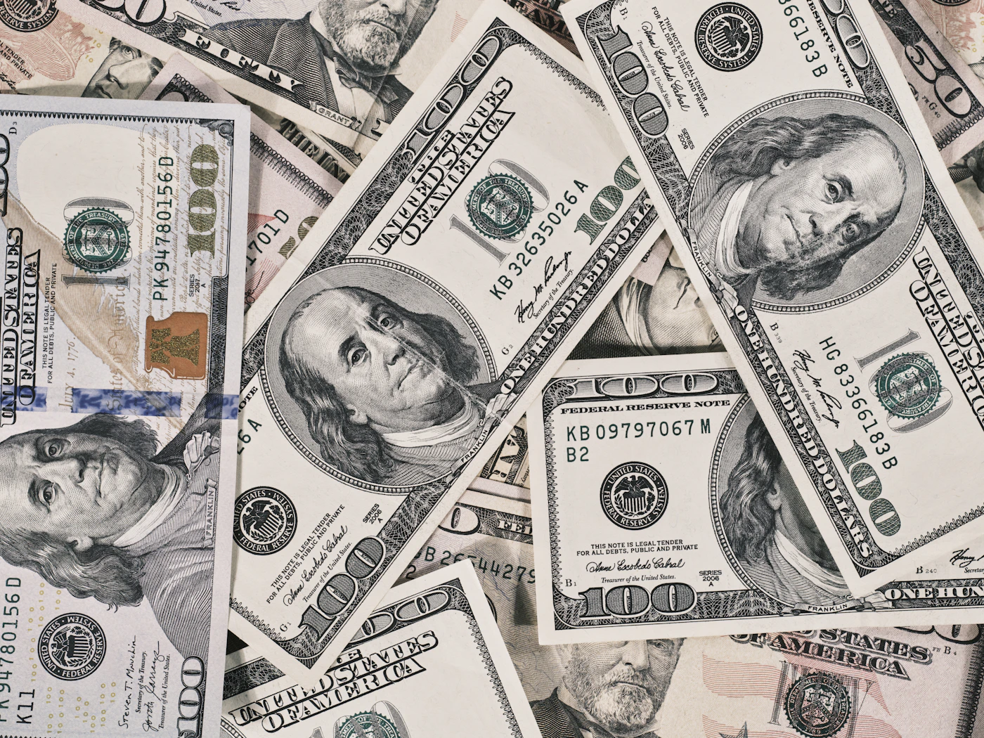 US $100 bills spread out