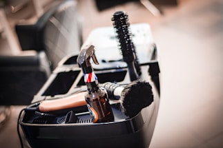 a close up of a brush and other items in a container