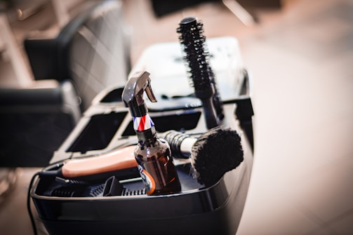 a close up of a brush and other items in a container