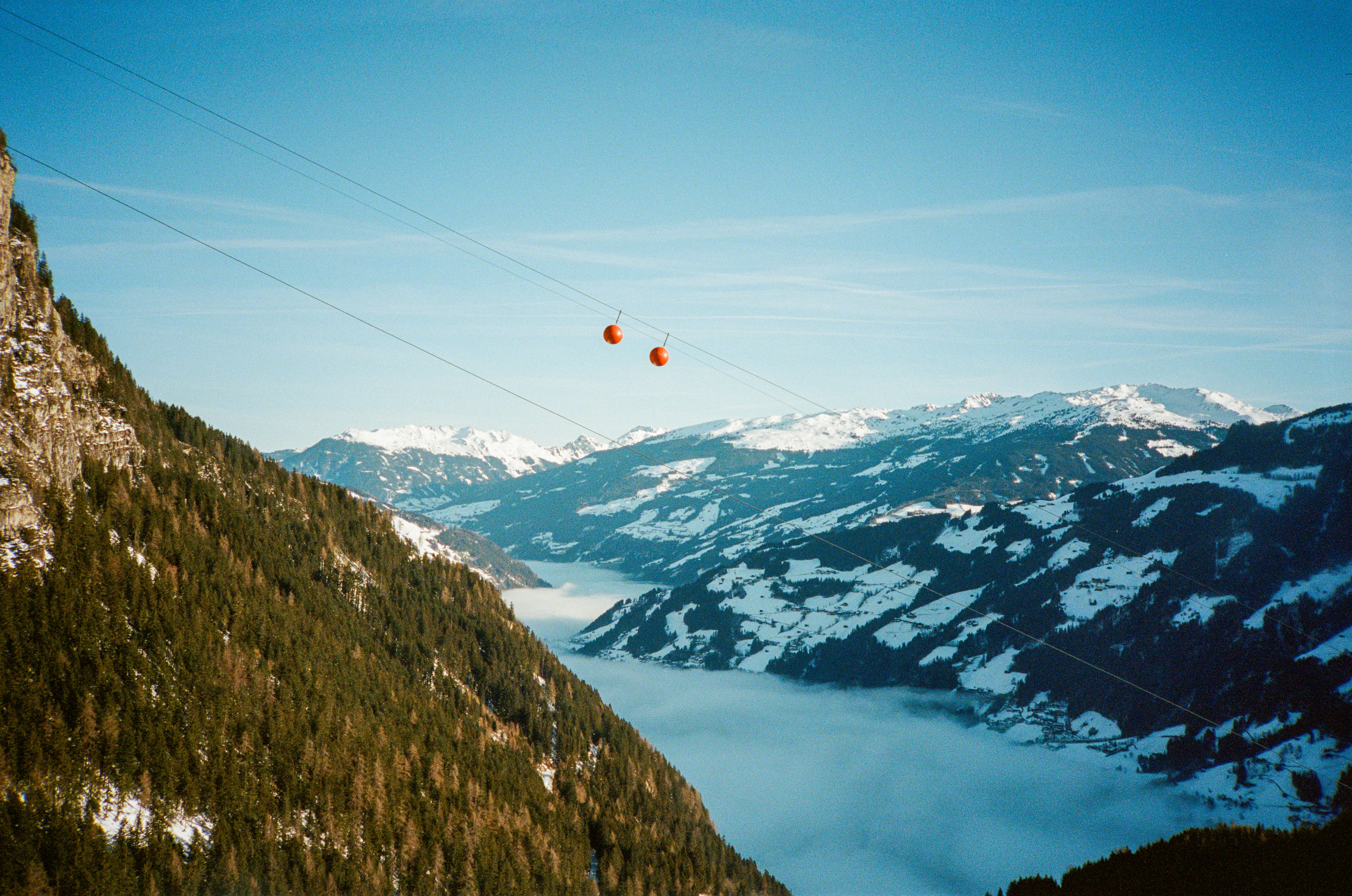 a view of a mountain range with snow on the ground