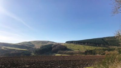 A panoramic view of rolling North Texas land ready for development under a clear blue sky.