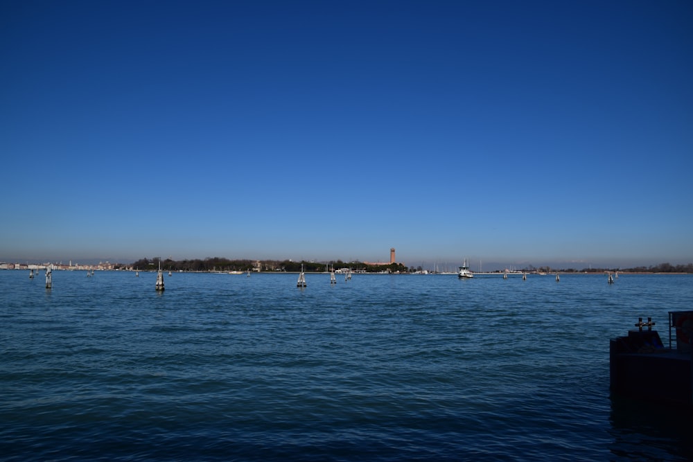 a body of water with boats floating on it