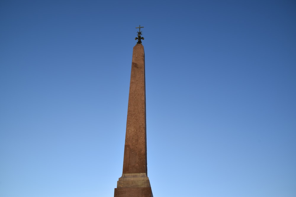 a tall monument with a cross on top of it
