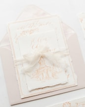 A simple, elegant invitation card with minimalistic design elements.