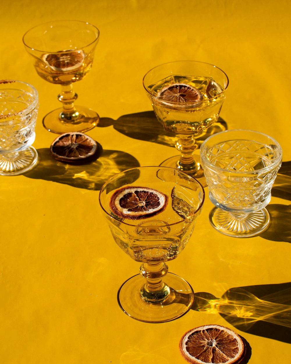 a group of wine glasses sitting on top of a table