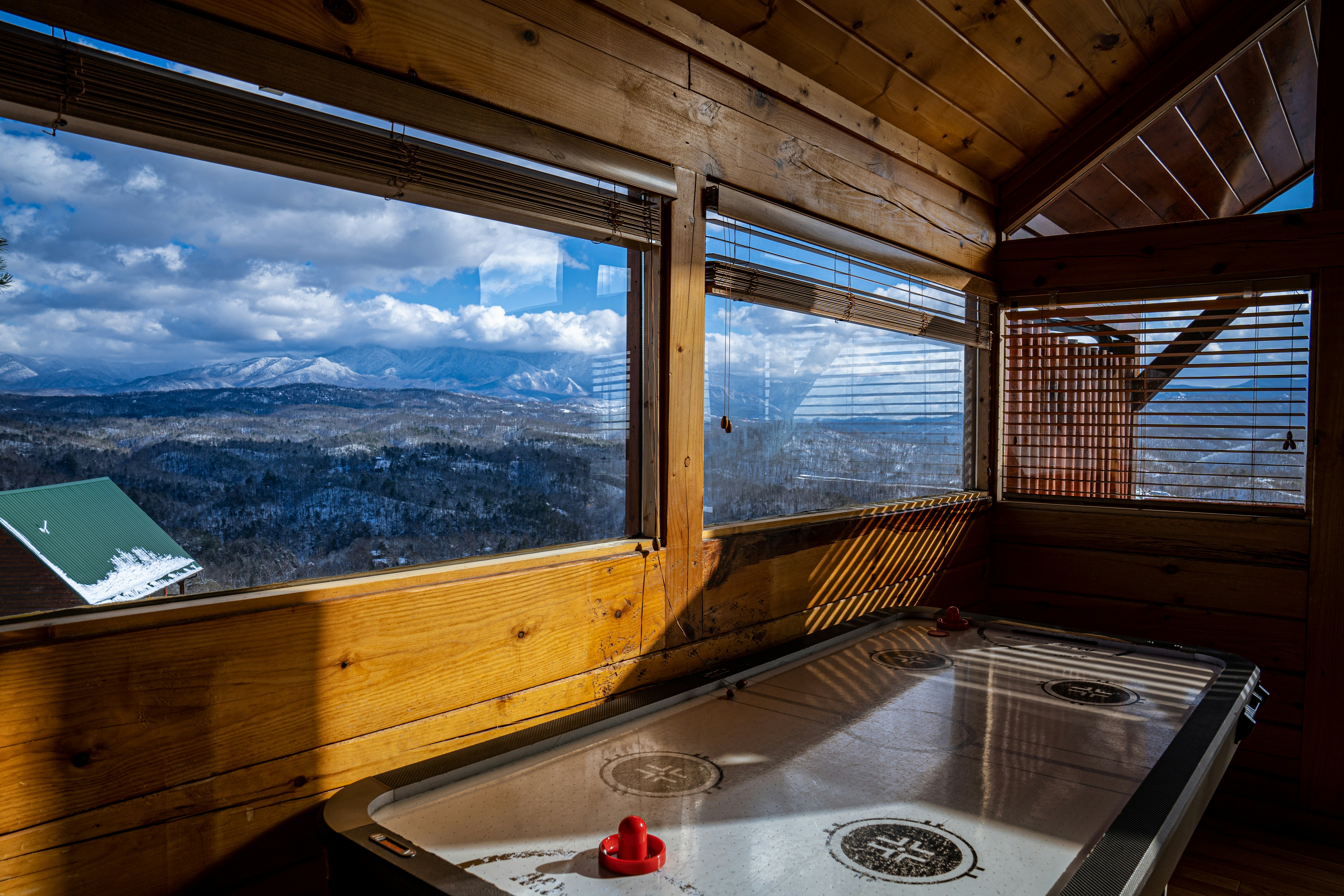 a hot tub inside of a wooden cabin