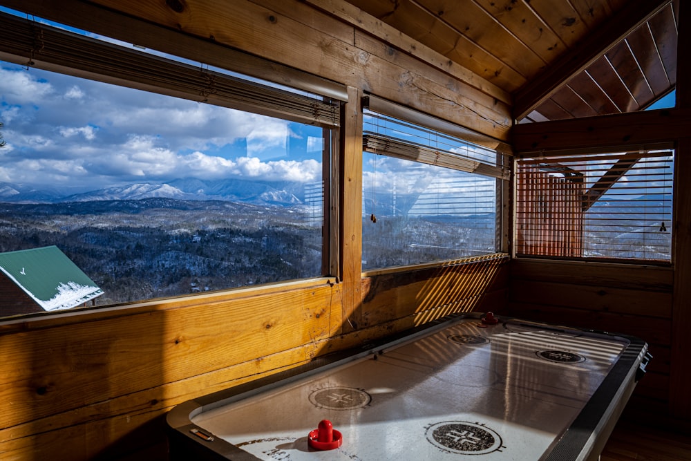 a hot tub inside of a wooden cabin