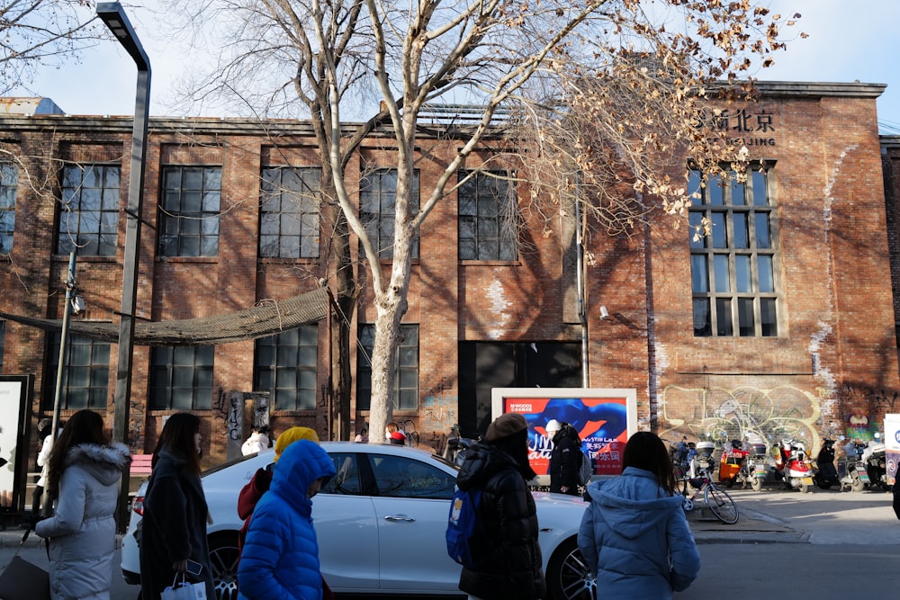 a group of people standing in front of a building