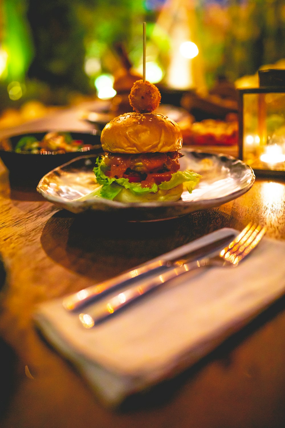 a plate with a sandwich on it sitting on a table