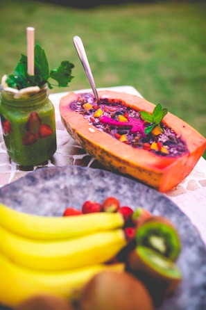 Close-up of a vibrant papaya milk drink with fresh papaya chunks.