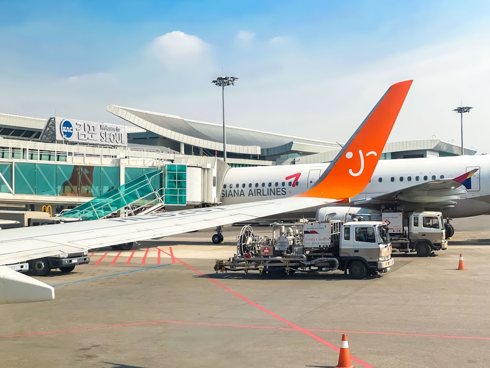 a large jetliner sitting on top of an airport tarmac