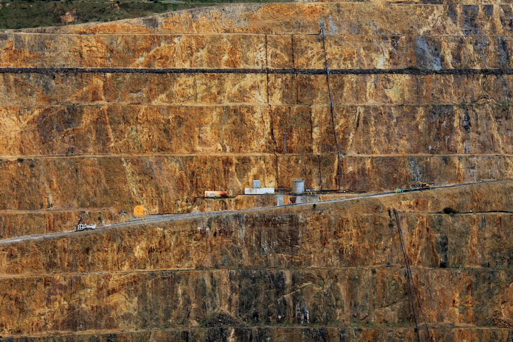 a very long road going through a huge mountain