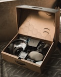 a cardboard box with various items inside of it