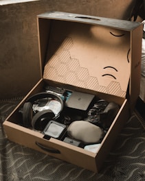 a cardboard box with various items inside of it