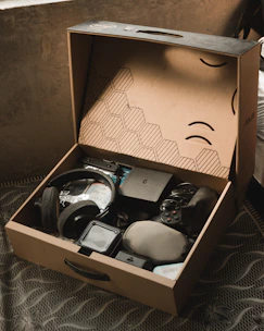 a cardboard box with various items inside of it