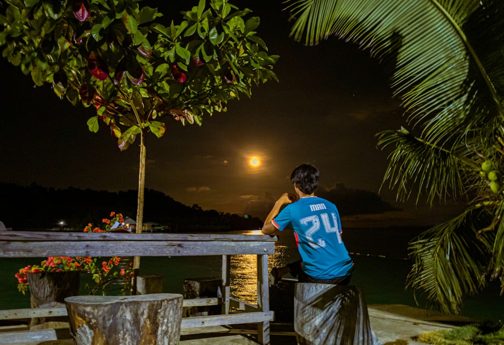 a person standing on a dock at night