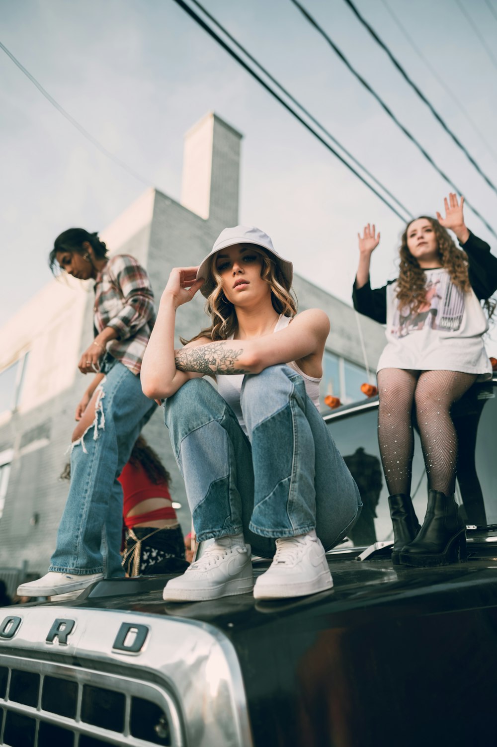 a group of people sitting on the back of a truck