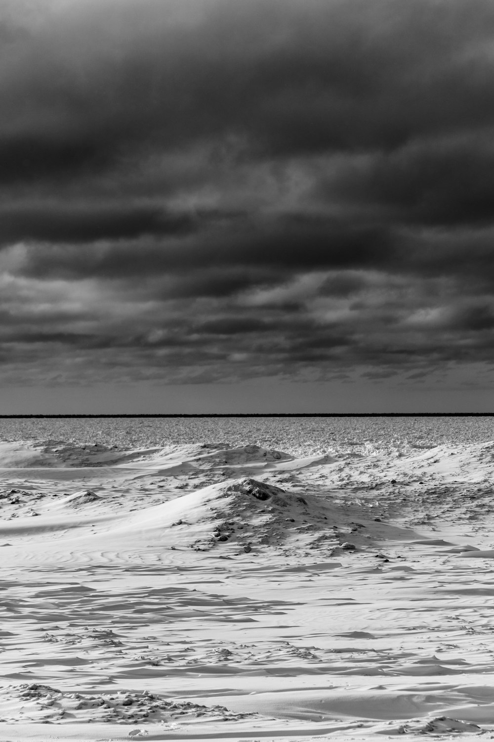 a black and white photo of the ocean